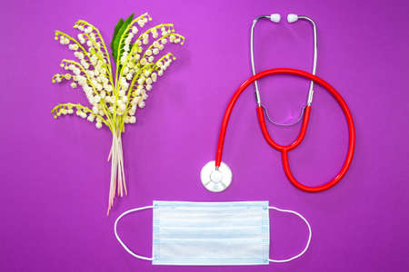 Medicine. Allergy treatment. Respiratory protection. Protective mask, stethoscope and flowers. Quarantine.の写真素材