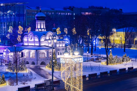 Christmas evening in Moscow. Top view of the snow-covered Church and Christmas decorations. New year celebration in Moscow. Street decorations in the Russian capital. New year in Russia.の写真素材