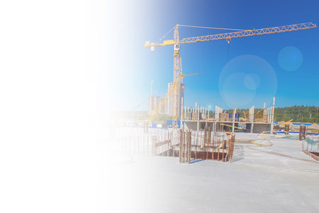 Housing construction. Construction site on a Sunny day. Space for text. A crane on the background of...