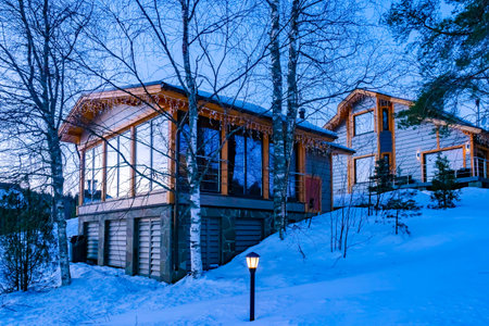 Winter comfortable cottages in Karelia. Houses in the snow. Christmas village for family holidays....