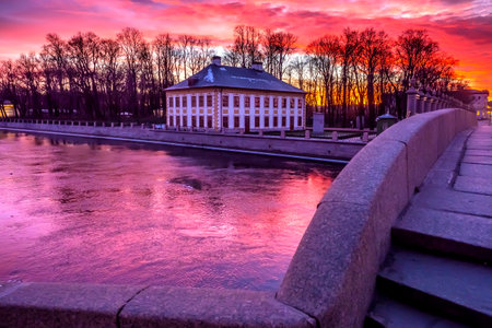 St. Petersburg. Russia. Summer Palace of Peter the great in the evening. Summer residence of Peter the Great view from Trinity bridge. Colorful Petersburg sunset. Neva River. Petersburg museums.のeditorial素材