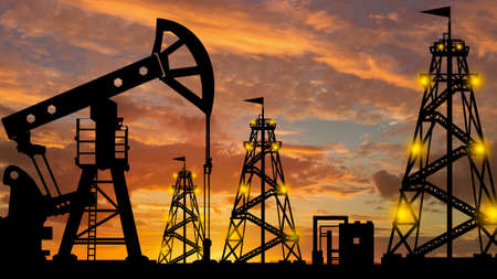 Silhouette of an oil production company. Natural resource extraction. Oil rigs against the evening sky. Oil export. Fuel industry. Global energy market.の写真素材