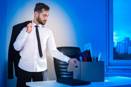 The concept of unemployment. The man was fired from his job. A person in an office suit on the...