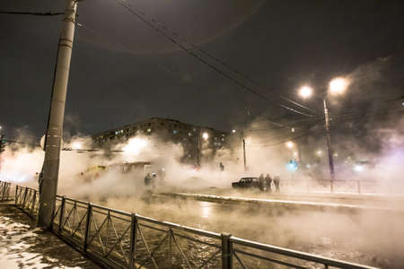 Breakthrough of hot water. Accident of heat supply. Emergency work.の写真素材