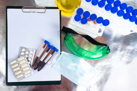 Concept of laboratory research in medicine. Table in the laboratory of a pharmaceutical company. Study of side effects of medications. Development of new drugs. Testing pills in the laboratory.の写真素材