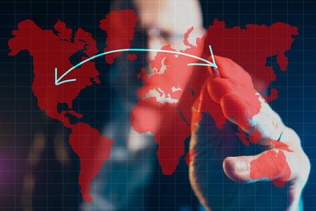 A person draws an arrow on the world map connecting Europe and America. Relations between countries...