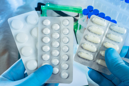 Antibiotics in the doctor hands. A cure for the pandemic. Production of medicines for pneumonia....