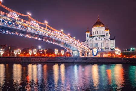 Christmas evening in Moscow. New year in the capital of the Russian Federation. View of the Cathedral of Christ the Savior in the evening. Festive illumination on the streets of Moscow.の写真素材