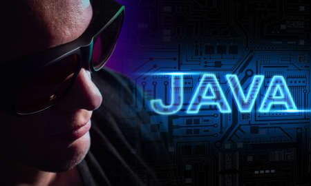 The concept of using the Java programming language and web development. A man with black glasses next to the Java logo. Computer language. Creating computer programs.の写真素材