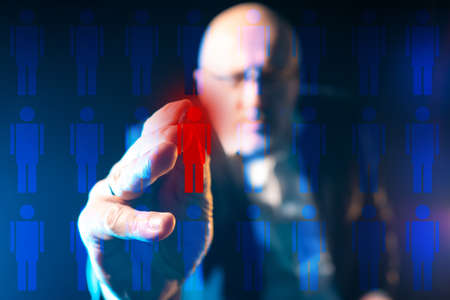 The chief selects employees for dismissal. Collage on the theme of staff reduction. Personnel policy. Unemployment. Reduction of the company's staff. The dismissal of an employee.の写真素材