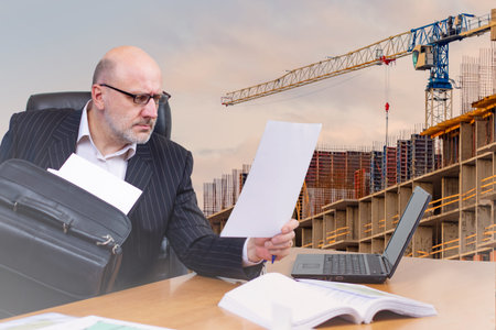 Architect. Architecture. Civil engineer on the background of a building under construction. A man at...