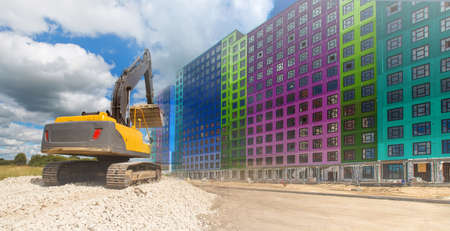 Construction. Construction equipment. Bulldozer on the background of a multi-colored house. New housing in the city. Apartments in buildings under construction.の写真素材
