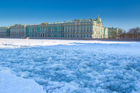 River Neva in the ice. Embankment of St. Petersburg. Winter in Russia. View of the Palace Embankment of St. Petersburg. Russia. Museums and architecture of St. Petersburg.のeditorial素材