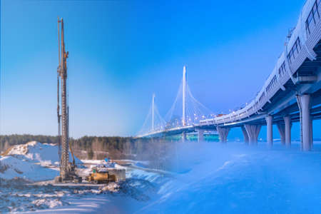 Construction of modern highways. Transport infrastructure. Road bridge. Multi-level road interchanges. Bridges and roads in the background of construction.の写真素材