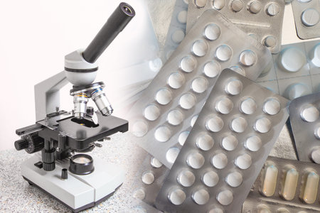 Microscope and tablets close-up. Pharmacology. Development of new drugs. Medical treatment of...