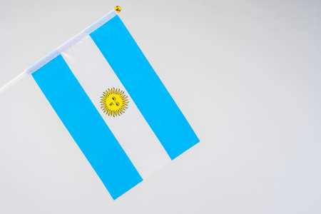 Official flag of the Argentine Republic. A blue-and-white striped banner with the sun in the middle. Official symbol of Argentina. Flag of Argentina on a white background.の写真素材