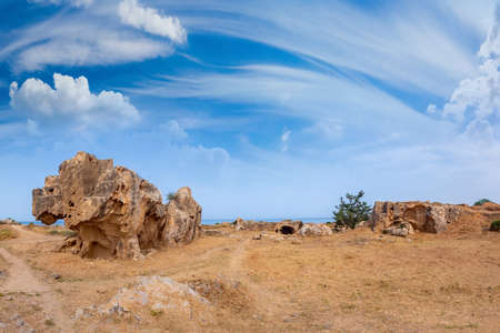Ruins of the ancient city of Paphos. Remains of ancient buildings under a blue sky with clouds in Cyprus. Archaeological excavations on the coast of the Mediterranean sea. Archeology.の写真素材