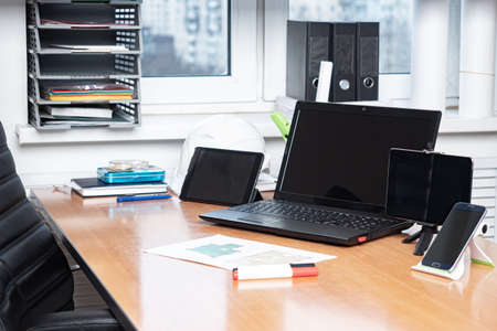 Remote work. Freelance. Contacts with clients using technology. Remote workstation. Work from home. Appliances on the desktop.の写真素材