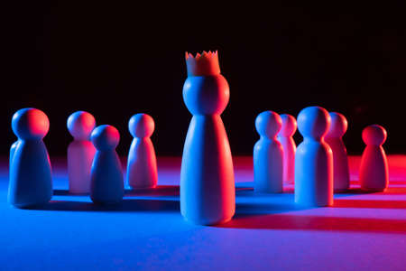 The ruler rises above the crowd. Winner of the crown among the crowd. Superiority over others. Well-deserved privileges.の写真素材