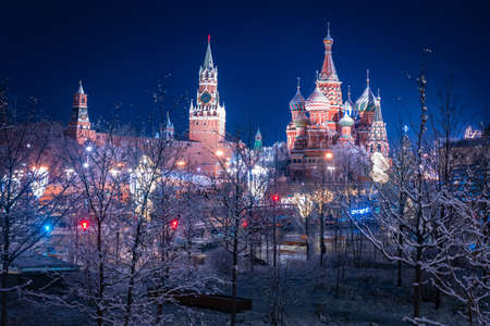 Christmas Moscow. New year in the capital of Russia. Christmas evening in the center of Moscow. Kremlin and St. Basil Cathedral on the background of a winter landscape. New year celebration in Russiaの写真素材