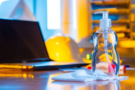 Bottle of disinfectant liquid close-up. Sanitizer for maintaining cleanliness in the workplace. Means for eliminating viruses and bacteria. Cleaning at the workplace. Compliance with hygiene rules.の写真素材
