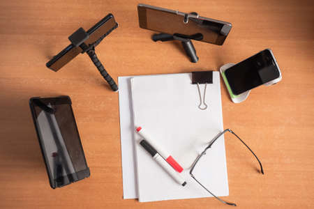 Working in self-isolation mode. Communication on business issues with the use of computer gadgets. Remote work during a coronavirus outbreak. Online communication with the outside world.の写真素材