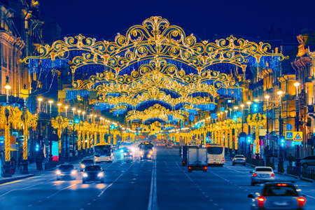 Christmas In Saint Petersburg. Nevsky Prospeï¿½t is decorated for the New year. Festive garlands on the streets of the city. New year trip to Russia. Vehicular traffic on the festive streets.の写真素材