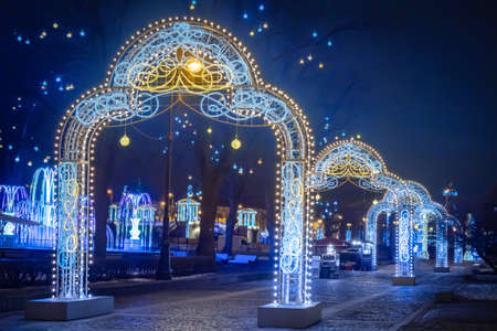 Christmas decorations on the street of the Russian city. New year in Russia. Arches of luminous garlands in Saint Petersburg. Christmas in the Russian Federation. Festive evening in St. Petersburg.の写真素材