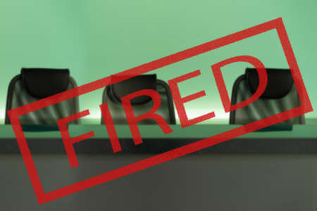 Fired. Concept - the labor market collapsed. fired on the background of empty armchairs. Concept - recession led to mass layoffs. bankruptcy led to the dismissal of employees. Unemployment.の写真素材