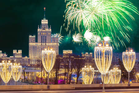 Fireworks over winter Moscow. New year celebration in the capital of Russia. Salute in honor of Christmas. Salute over decorated Moscow. The Russian Federation is celebrating the New year.の写真素材