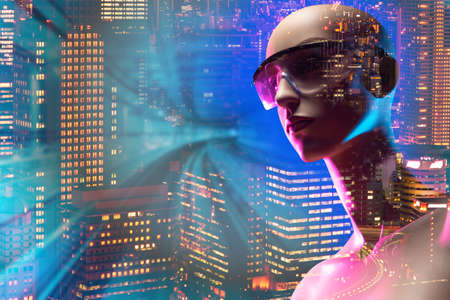 Artificial Intelligence. Humanoid robot background of night city. Robot next to a railroad. Concept - control of trains using artificial intelligence. Unmanned trains. Modern technologies.の写真素材