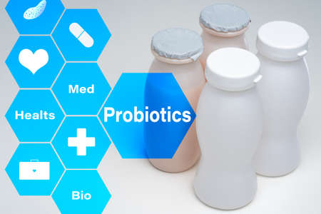 Use probiotics in medicine. In small bottles are probiotics. Production of biological probiotics. Sale of biologically active additives. Taking bio supplements promote health. Living microorganisms.の写真素材