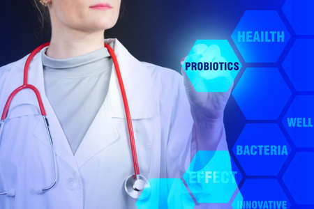 Probiotics bacteria. Medic girl clicks on inscription probiotics. Medical products with probiotics. Disease treatment. Use of bacteria to treat bacteria. Useful microorganisms. Immunity recovery.の写真素材