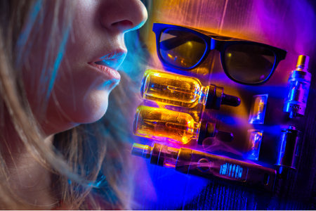 Vape girl lips exhale smoke. Vaping vapor next to vape girl lips. Vaper set next to woman vaper....