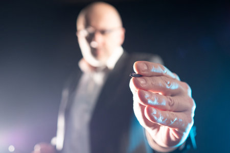 Business. Stylus in hands of a businessman. Man pulls his hand to camera. Concept - businessman is writing something on screen. Businessman clicks on a virtual screen. Blurred background. Investor.の写真素材