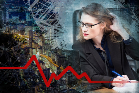 Woman near night city. Accountant. Graph shows that the situation has stabilized. Evening metropolis top view. Concept - financial analyst makes a forecast. Woman works at night. Fall stop forecastの写真素材