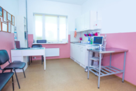 Veterinary clinic. Blurry veterinary office. Empty office of a veterinarian. Concept - career of a veterinarian. Concept - equipment for a Veterinary clinic. Office veterinarian blurry background.の写真素材