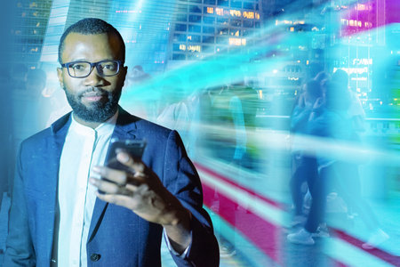 Man with cell phone. Concept - using high-speed Internet. African American with smartphone in his...