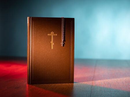 Christian faith. The direction of Christianity. Orthodox cross on the Bible. Faith in Jesus Christ. Communication with God. Symbol of Orthodoxy. Crucifix on a chain and a Holy Bible.の写真素材