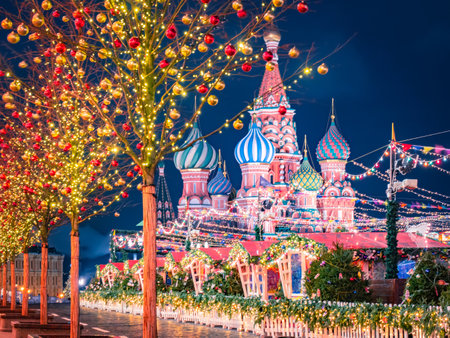 New Year in Moscow. Christmas fair in capital of Russia. St. Basil's Cathedral. Christmas market on red square. Trees are decorated with New Year's toys. Center of Moscow on a winter night.の写真素材