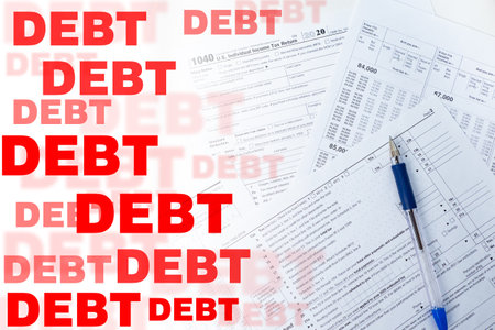 Debts collection. Duty. Inscription debt next to the tax return. Filling in tax forms. Concept - debt collection by the tax service. Debt consolidation. 1040 US individual income return.の写真素材