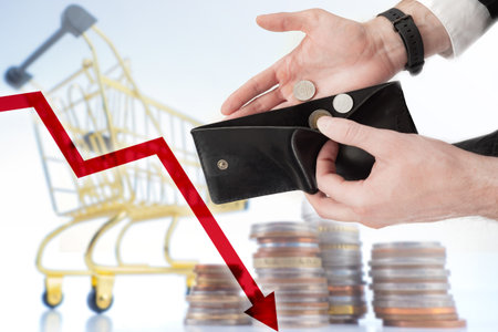 Decrease in purchasing power. Falling chart next to coins. Man shows empty wallet. Concept - drop in...