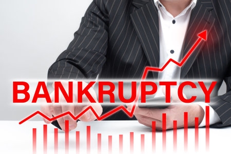 Bankruptcy court. A growing schedule of bankruptcies next to a man. Growth in number of bankruptcy court. Concept - financial lawyer in background. Forecast increasing number of bankruptcyの写真素材