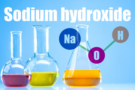 NaOH. The inscription nadrium hydroxide. Test tubes with multi-colored substances. NaOH on one of the test tubes. Concept - the use of alkali in soap making. Caustic substance. Caustic sodaの写真素材