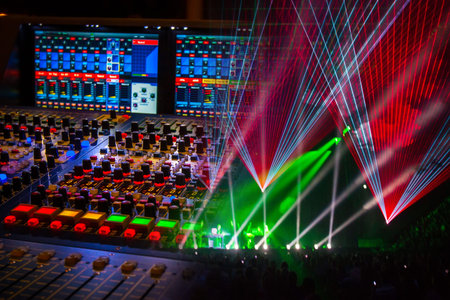 DJ mixing console close up. Concept - sound supply of concerts. View of the stage during a concert....