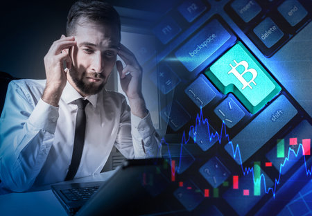 Bitcoin mining. A man Trades cryptocurrency. Savings in bitcoins. Savings in cryptocurrency. Reliability of investments in bitcoins. Financial strategy.の写真素材