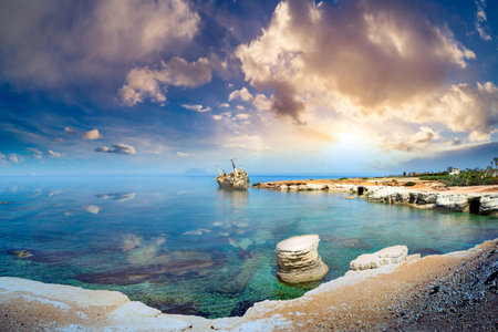 Cyprus beach. Paphos. Panorama of beach with remains of a ship. View of Mediterranean Sea. Landscape of the Cyprus coast. Nature of city of Paphos. Tour to city of Paphos. Cyprus attractions.の写真素材