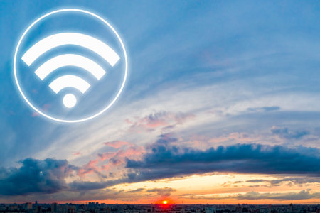WiFi sign over the city. Concept - WiFi access is distributed from satellites. Wireless internet access for the entire city. Concept - free WiFi for all residents. Sunset over the city.の写真素材