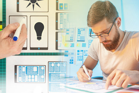 A man develops the design of the Smart home application. An engineer is working on a home automation...