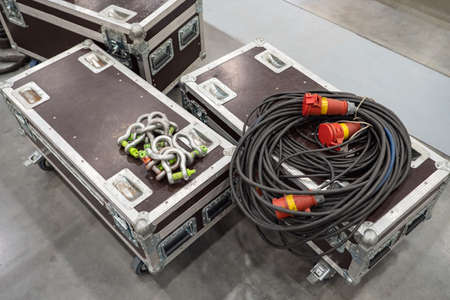 Preparation for the concert. The connection of concert equipment. Boxes with concert equipment, cables and carbines. Preparation for the exhibition. Installation of equipment.の写真素材